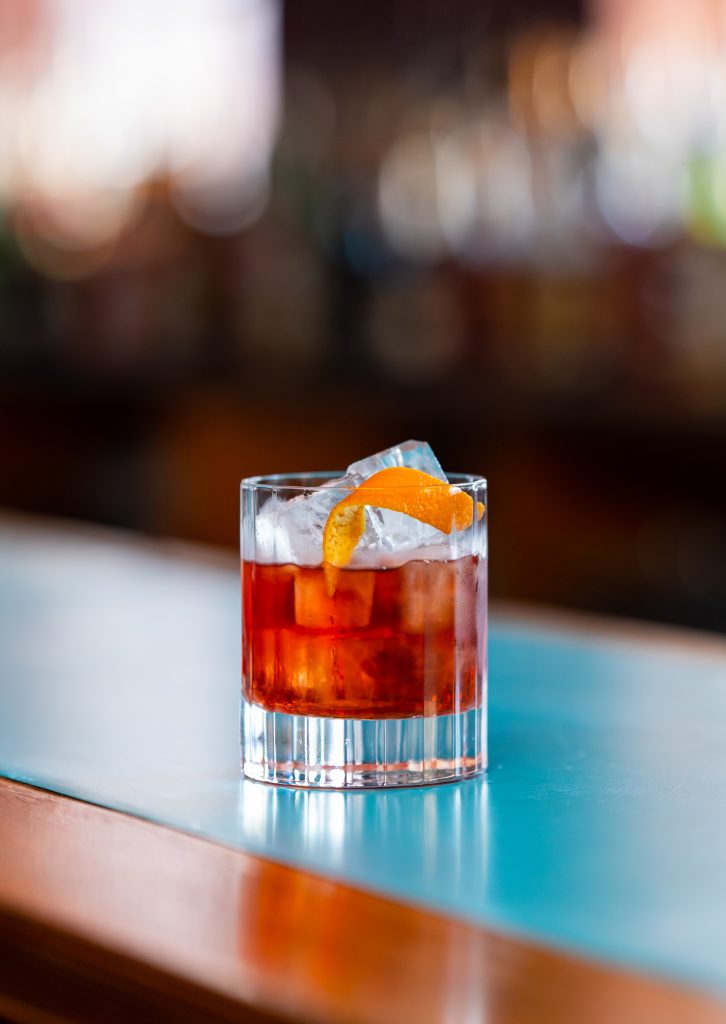 Picture of a Negroni in a small rocks glass.