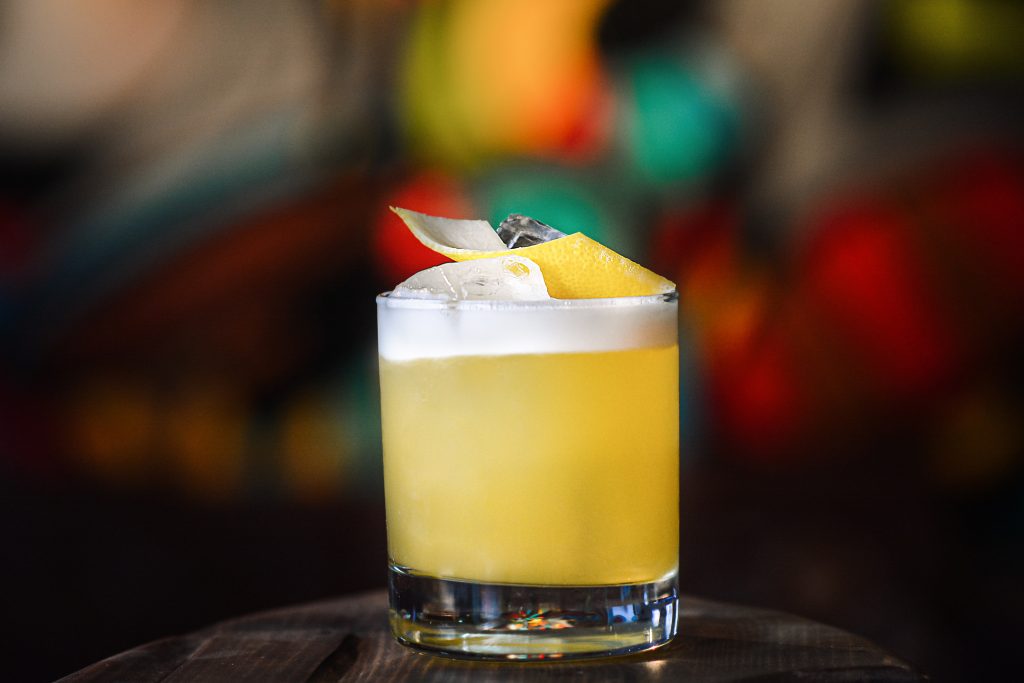 A whiskey sour cocktail made with a vegan alternative to egg white in cocktails